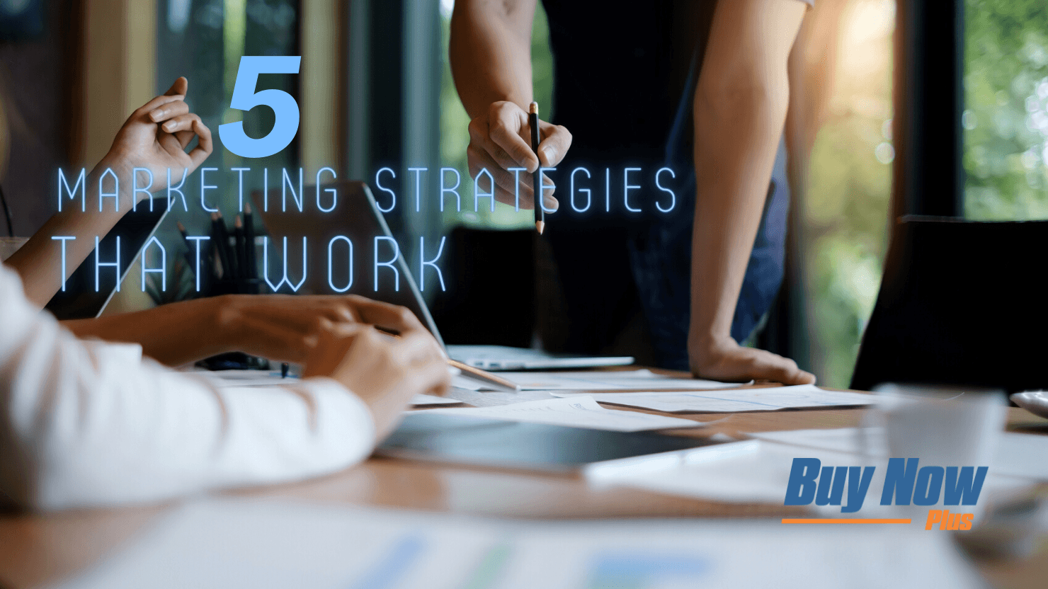 A marketing room. Text reads "5 marketing strategies that work". The Buy Now Plus logo is present.